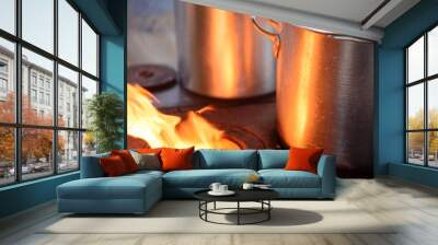 two aluminum pans on wood stove Wall mural