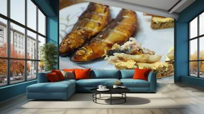 Rye bread with smoked vendace and cream cheese. Whole fishes on background. Wall mural