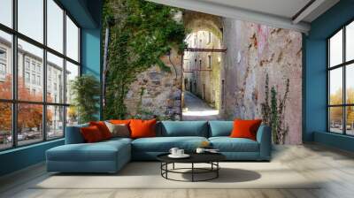 Arched doorway in abandoned Italian village of Balestrino - landscape color photo Wall mural