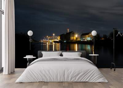 night view of the city with harbor and reflections on the water Wall mural