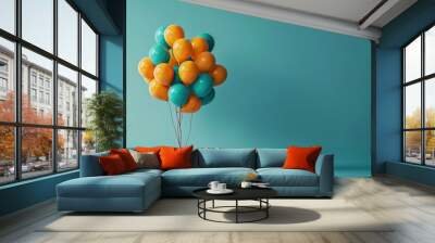 Cluster of orange and teal balloons on a turquoise background, concept of celebration and party Wall mural