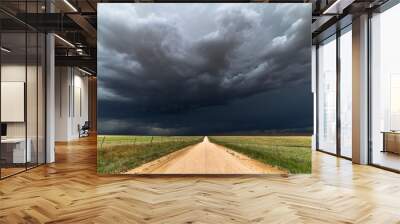 Dirt road with dark storm clouds Wall mural