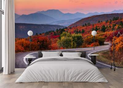 Winding mountain road and autumn landscape Wall mural