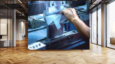 Workers bending sheet metal by CNC machines in industrial plants Wall mural