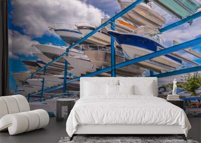 boats stored up in dry storage waiting for maintenance Wall mural