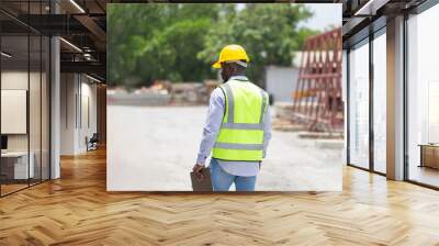 Back view of engineer man in hardhats on construction site, Foreman checking project at the precast concrete factory site Wall mural