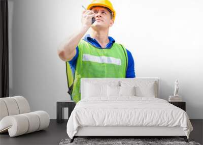 Portrait of worker man in a uniform, foreman in hardhat, job and occupation concepts Wall mural