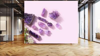 amethyst minerals set and white flowers close up on abstract light pink background. gemstones for esoteric spiritual practice, Crystal Ritual, Witchcraft. top view. copy space. template for design Wall mural