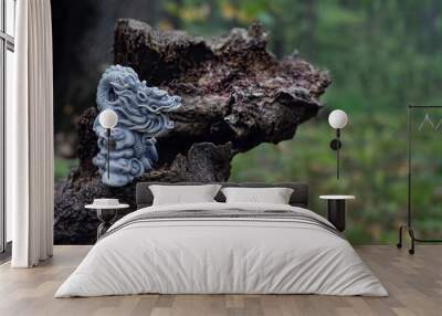 asian dragon statue on old tree trunk, natural forest background. beautiful stone dragon, symbol of wisdom, good start, Imperial power, deity. Fabulous atmosphere mystery witchcraft composition Wall mural