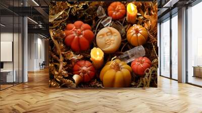 autumn background. Decorative pumpkins, candles, amulet of moon, crystals close up on dry leaves and stems abstract backdrop. Witchcraft. esoteric spiritual ritual for mabon, halloween, samhain Wall mural