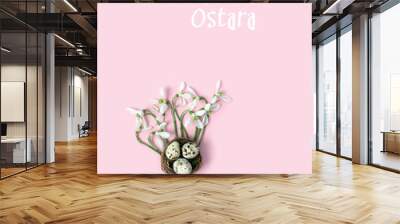 Blessed Ostara greeting card. Snowdrop flowers and eggs in nest on abstract pink background. symbol of Easter holiday, wiccan Ostara sabbat. spring festival decor. flat lay. minimal style Wall mural