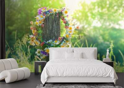 rustic wildflowers wreath on sunny meadow. Summer Solstice Day, Midsummer concept. floral traditional decor. pagan witch traditions, wiccan symbol and rituals. Wall mural