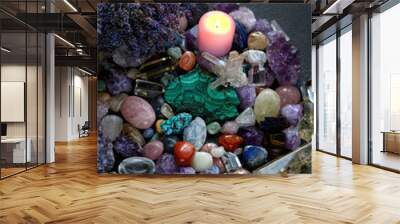 set of colorful minerals, candle, lavender flower on dark abstract background. Gemstones for magic healing Crystal Ritual. esoteric spiritual practice for aura cleansing, relax. Wall mural