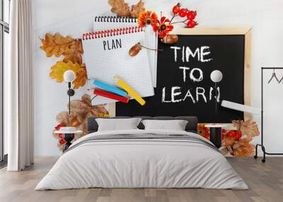 Time to learn. autumn leaves, notepad, pencils on background of school blackboard with chalk. concept of school education, 1 september. beginning of school year Wall mural