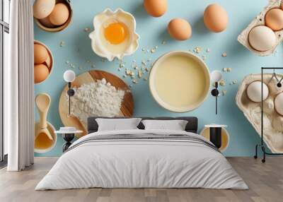 Baking ingredients on pastel blue background Wall mural