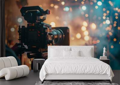 Professional camera on a film set with bokeh lights Wall mural