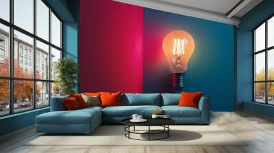 Single glowing light bulb with contrasting pink and blue lighting Wall mural