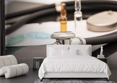 still life of a stethoscope with pacemaker battery and medical objects Wall mural