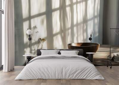 Wooden bowl on rustic table with soft window light and shadows Wall mural