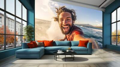 handsome young surfer smiling and taking a selfie while surfing a wave on a summer day Wall mural