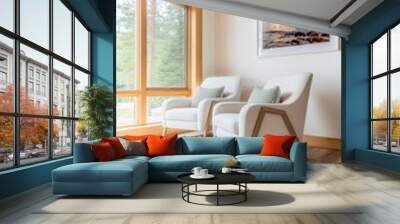 Cozy living area with two chairs and a scenic view in a modern wooden home interior Wall mural