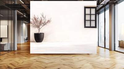 Minimalist design featuring a potted tree next to a black-framed window on a clean white wall in a serene outdoor setting Wall mural