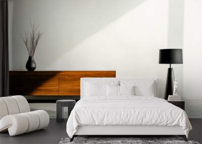 Modern living room interior with minimalist decor featuring a wooden cabinet and a black floor lamp Wall mural