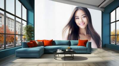 Portrait of a young beautiful asian woman isolated from a bright background Wall mural