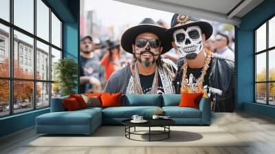 Two men in costume on a street celebrating the Day of the Dead Wall mural