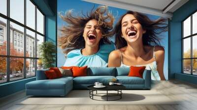 Two young friends dressed in blue have fun and laugh Wall mural