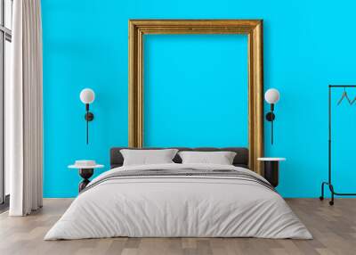 gold photo frame in a blue wall Wall mural