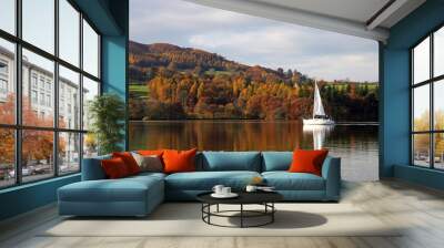 Yacht against autumn colours on Lake Windemere, Lake District England Wall mural