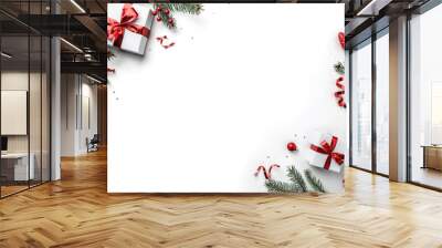 Christmas fir branches, gift boxes with red ribbon, red decoration, sparkles and confetti on white background. Xmas and New Year greeting card, winter holiday. Flat lay, top view Wall mural