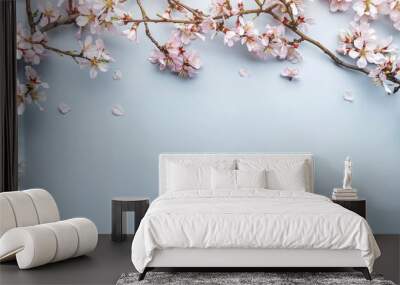 Flowering Spring, sakura blossoming branches on light blue background with bokeh, light. Happy Easter holiday, top view, banner Wall mural