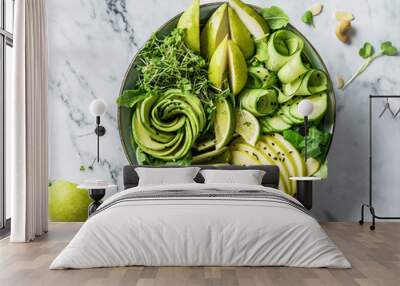 Fresh summer salad with avocado, kiwi, apple, cucumber, pear, micro greens, lime and sesame on light marble background. Healthy food, clean eating, Buddha bowl salad, top view Wall mural