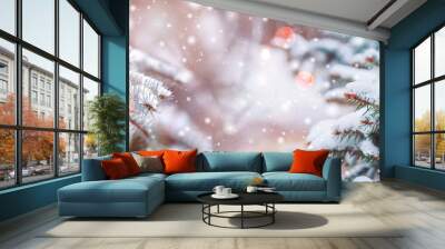 Frosty winter landscape in snowy forest. Christmas background with fir trees and blurred background of winter. Wall mural