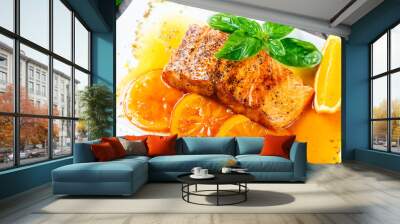 Honey Glazed fillet salmon with orange slices, spices and basil on white plate on dark background. Delicious dish of seafood. Wall mural