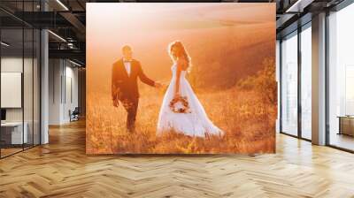 Fine art photo of an attractive wedding couple Wall mural