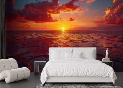 Stunning sunset over cracked salt flats reflecting vibrant colors in the sky Wall mural