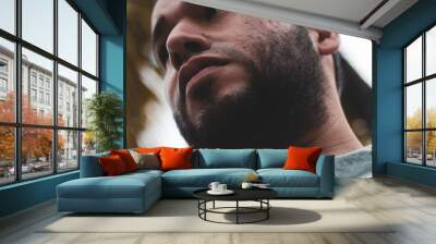 cute bearded latin man seen from below Wall mural