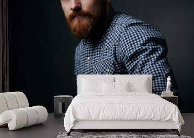 thoughtful red bearded man studio portrait on dark background Wall mural