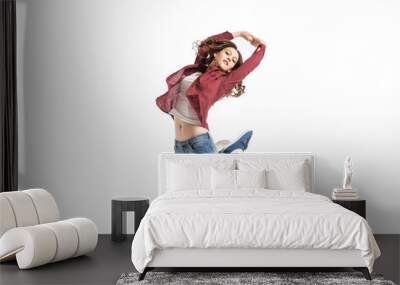 Young girl dancing over white background Wall mural