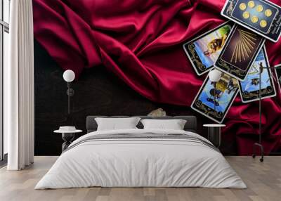 Assortment of Tarot inspired cards on a wooden background Wall mural