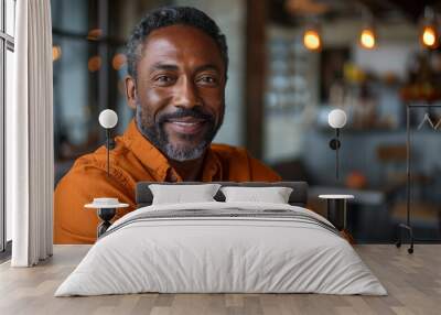 Handsome 40 50 years old black man smile and sitting in chair Wall mural