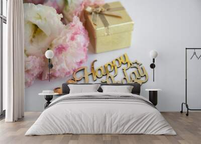 A birthday inscription on a white background with a gold box with a gift and flowers Wall mural