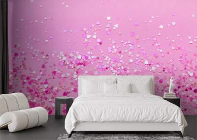 Abstract background of pink heart-shaped sparkles. Wall mural