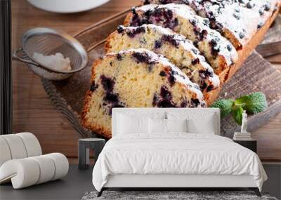 Summer loaf of fresh blueberry muffin bread cake decorated with mint closeup on a table Wall mural