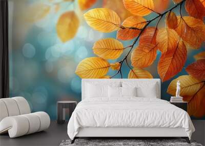 Autumn background with yellow and orange leaves on tree branches. Autumn concept, fall season nature blurred background Wall mural