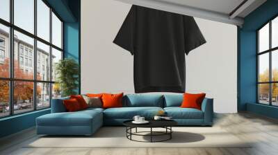 Black oversized t-shirt floating in the air. there is a white wall in the background Wall mural