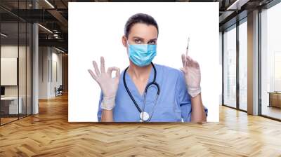 Doctor in mask with a syringe in his hand, closeup. Vaccination and immunization. Vaccination concept. Isolated. nurse with syringe      Wall mural